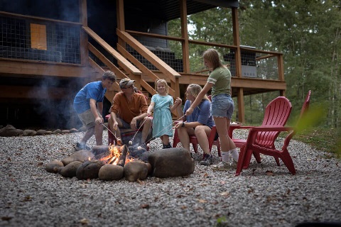 Roper Family enjoys a campfire on their rural property in Sparta, Tennessee